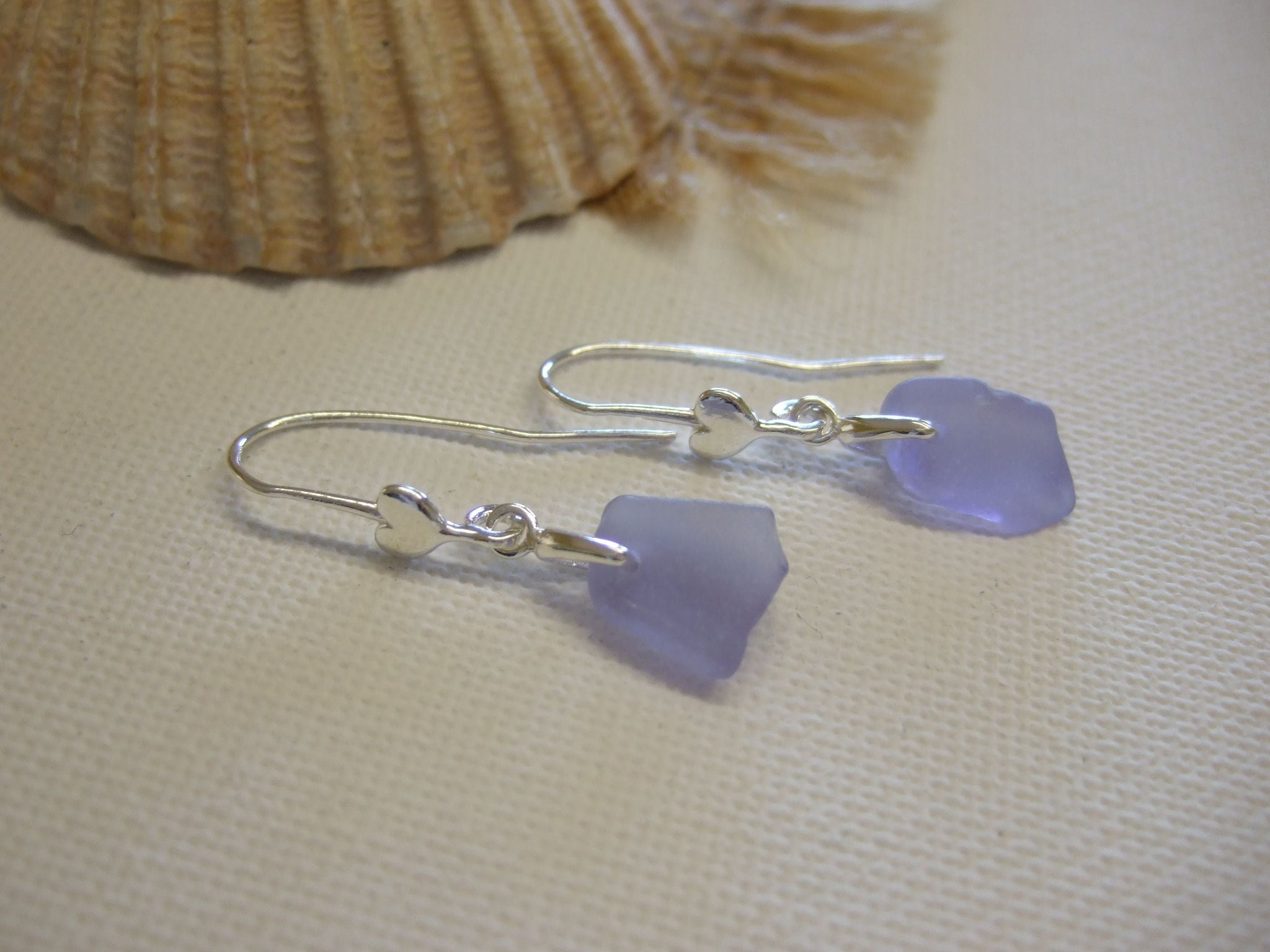 Charmed! Rhodium plate open heart earrings on hypoallergenic surgical –  SeaCycled Glass